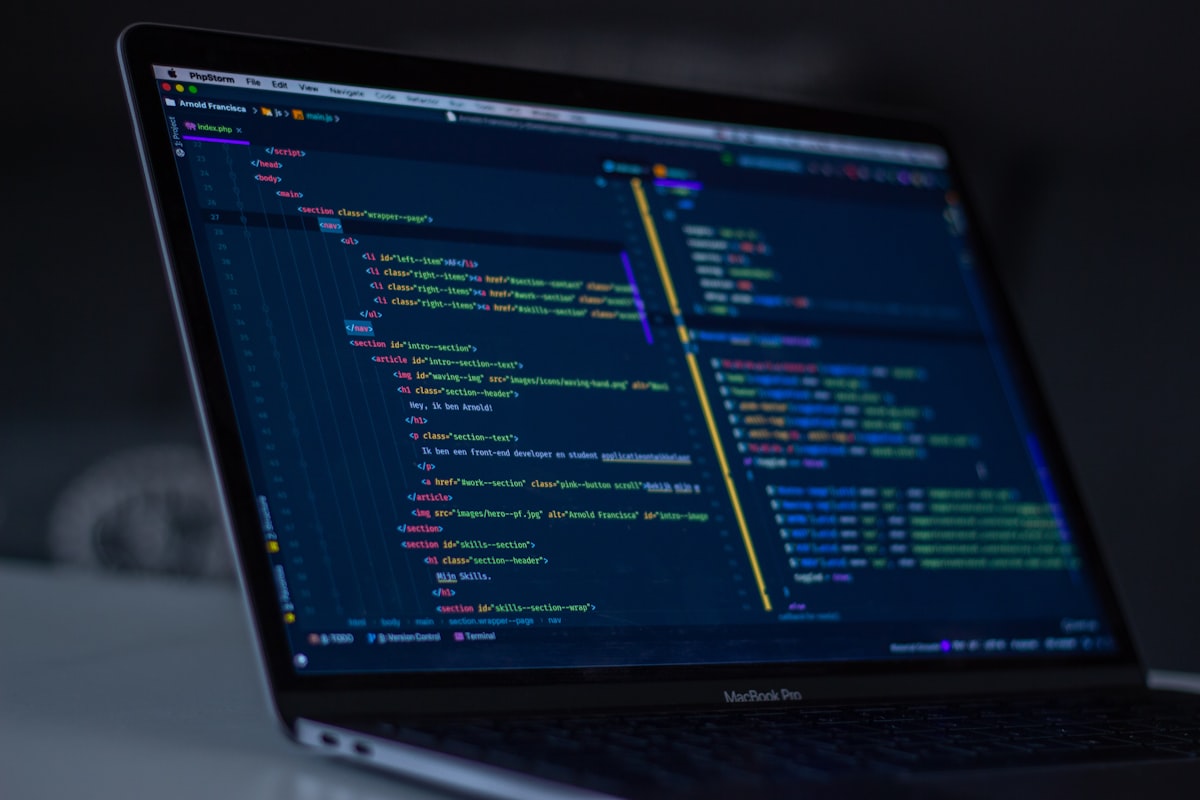 Developer using multiple monitors for debugging code